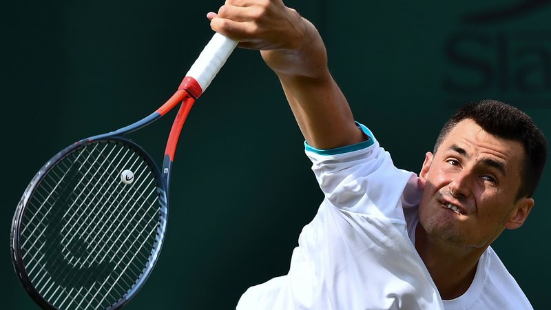 Fotografija: Avstralski teniški igralec Bernard Tomic naj bi se v Wimbledonu premalo trudil. FOTO: AFP