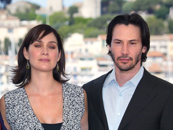 Keanu Reeves in Carrie-Anne Moss FOTO: Francois Guillot/AFP