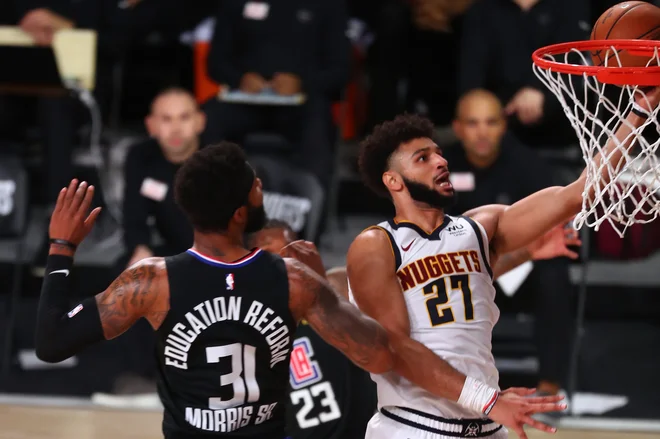 Jamal Murray (desno) je proti LA Clippers dosegel 40 točk in je bil prvi mož odločilne sedme tekme za uvrstitev v finale zahodne konference. FOTO: Kim Klement/USA Today Sports