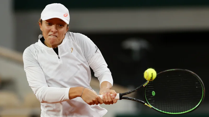 Fotografija: Poljakinja Iga Šwiatek je presenetila favorizirano Romunko Simono Halep. FOTO: Thomas Samson/AFP
