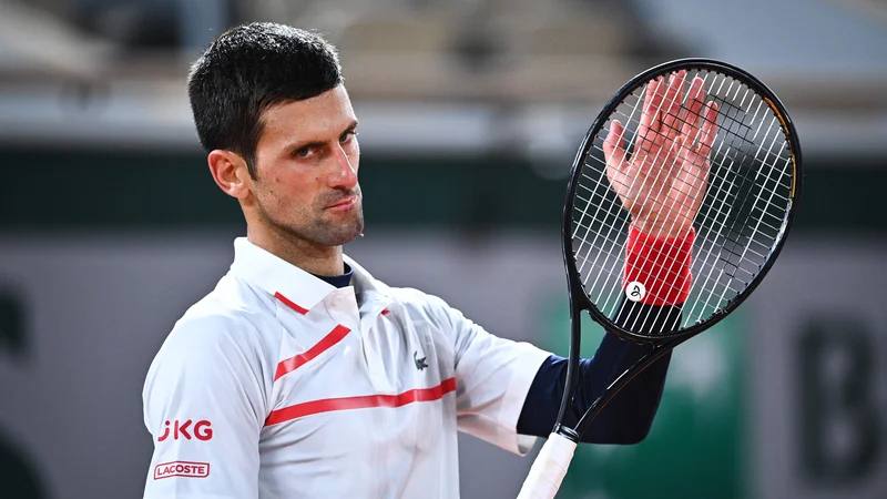Fotografija: Novak Đoković si je zaploskal za novo zmago. FOTO: Anne-christine Poujoulat/AFP