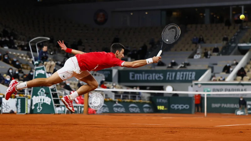 Fotografija: Novak Đoković se je moral pošteno potruditi za zmago. FOTO: Thomas Samson/AFP