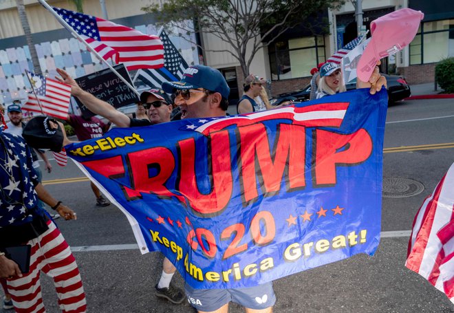 Podpornik ameriškega predsednika Donalda Trumpa. FOTO: Kyle Grillot/AFP