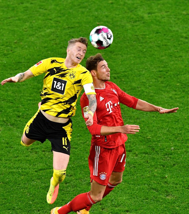 Marco Reus (levo) je v 45. minuti popeljal vodstvo Borussio Dortmund. FOTO: Martin Meissner/AFP