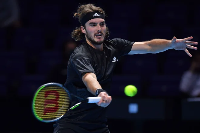 Tsitsipas je doživel poraz na turnirju, ki ga je lani osvojil. FOTO: Glyn Kirk/AFP