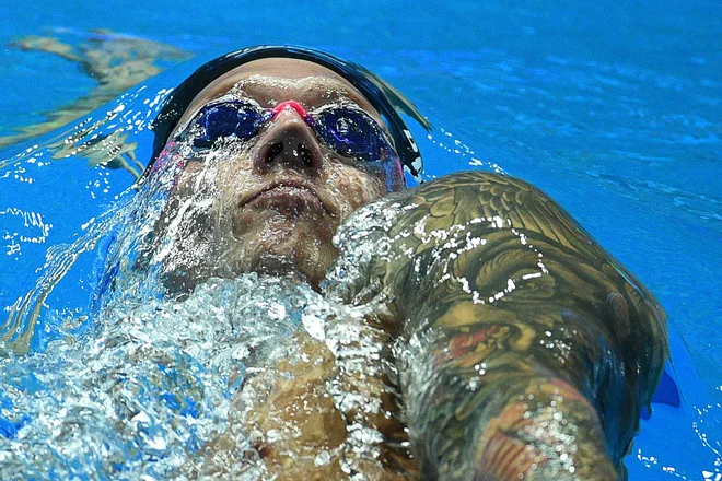 Caeleb Dressel ruši mejnike v plavanju. FOTO: Oli Scarff/AFP
