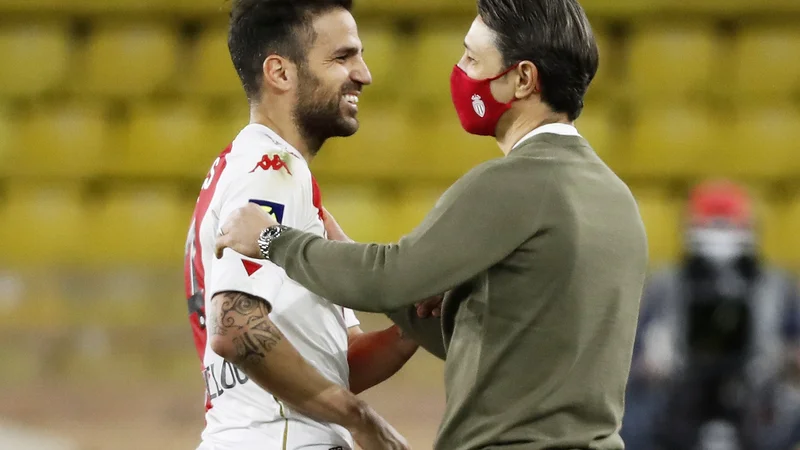 Fotografija: Cesc Fabregas in Monacov trener Niko Kovač. FOTO: Eric Gaillard/Reuters