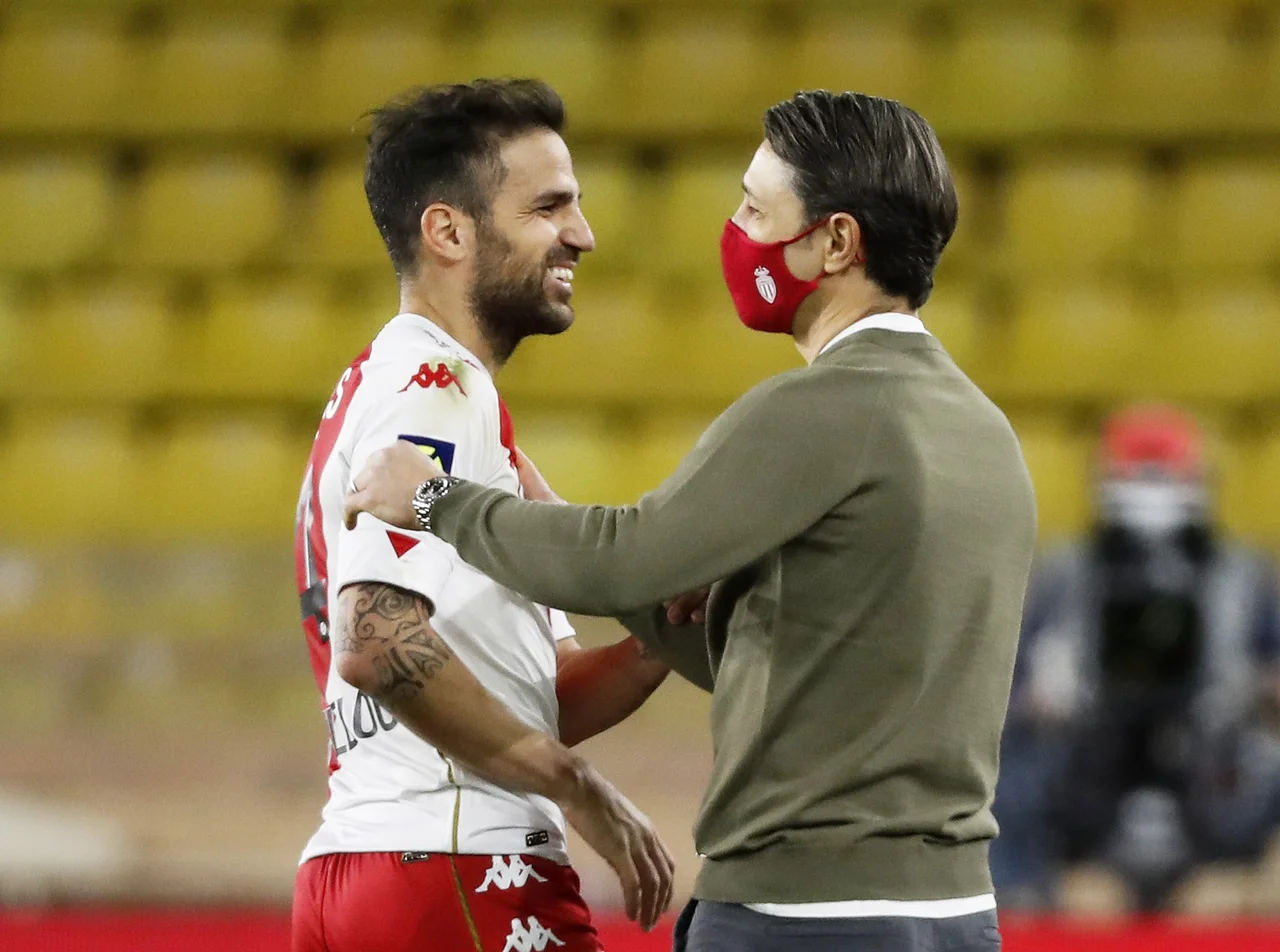 Fotografija: Cesc Fabregas in Monacov trener Niko Kovač. FOTO: Eric Gaillard/Reuters