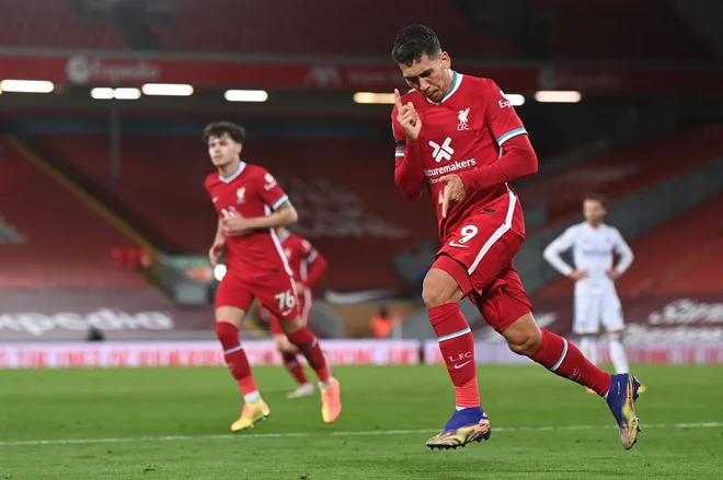 Roberto Firmino je le premagal strelski urok. FOTO: Laurence Griffiths/AFP