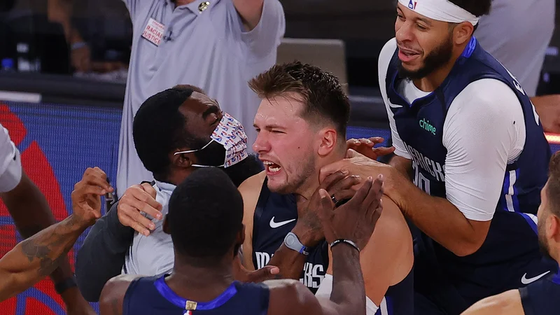 Fotografija: Z Luko Dončićem bosta poslej igrala tudi Avstralec Josh Green in Američan Tyler Bey. FOTO: Kevin C. Cox/AFP