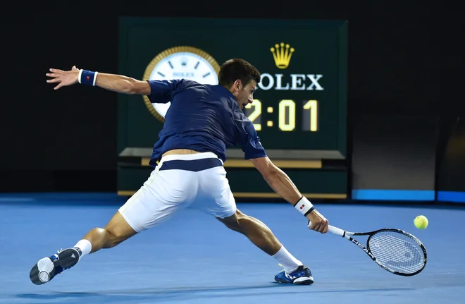Na OP Avstralije bo naslov prvaka med posamezniki branil Srb Novak Đoković. FOTO: Saeed Khan/AFP - International News Agency