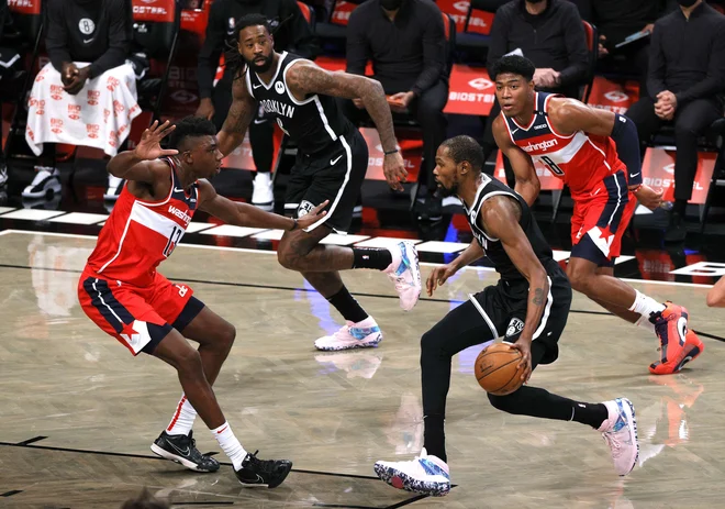 Kevin Durant je na parket stopil prvič po 522 dneh. FOTO: Sarah Stier/AFP