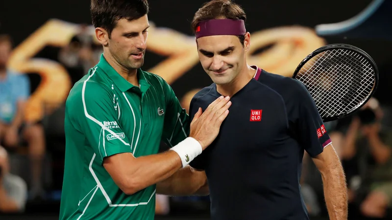 Novak Đoković in Roger Federer sta znova v središču pozornosti. FOTO: Issei Kato/Reuters