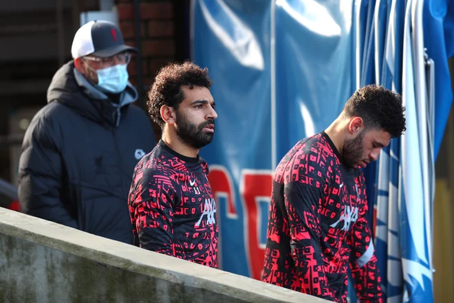 Jürgen Klopp je zavrnil govorice, da je Mohamed Salah nezadovoljen pri angleških prvakih. FOTO: Clive Rose/Reuters