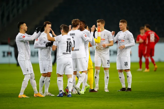 V Mönchengladbachu niso skrivali veselja ob zmagi proti branilcem naslova prvakov. FOTO: Wolfgang Rattay/AFP
