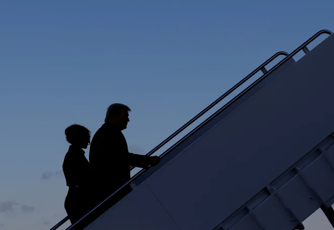 Zakonca Trump odhajata v zgodovino. FOTO: Carlos Barria/Reuters