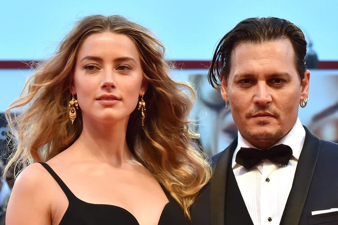 Z Amber Heard leta 2015, ko je bil igralski par še sveže poročen. <br />
FOTO: Giuseppe Cacace/AFP