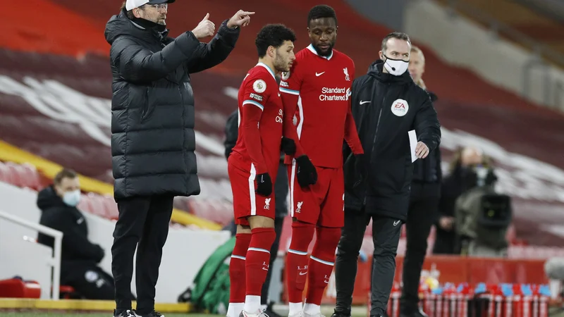 Fotografija: Varovanci Jürgena Kloppa po zadnjem porazu za vodilnim Manchester Cityjem s tekmo več zaostajajo že za 7 točk. FOTO: Phil Noble/Reuters