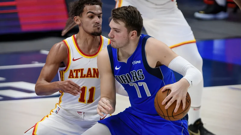 Fotografija: Luka Dončić in Trae Young sta stara in znana tekmeca, ki sta tekmovalnosdst v NBA začela že z menjavo na naboru. FOTO: Jerome Miron/Usa Today Sports