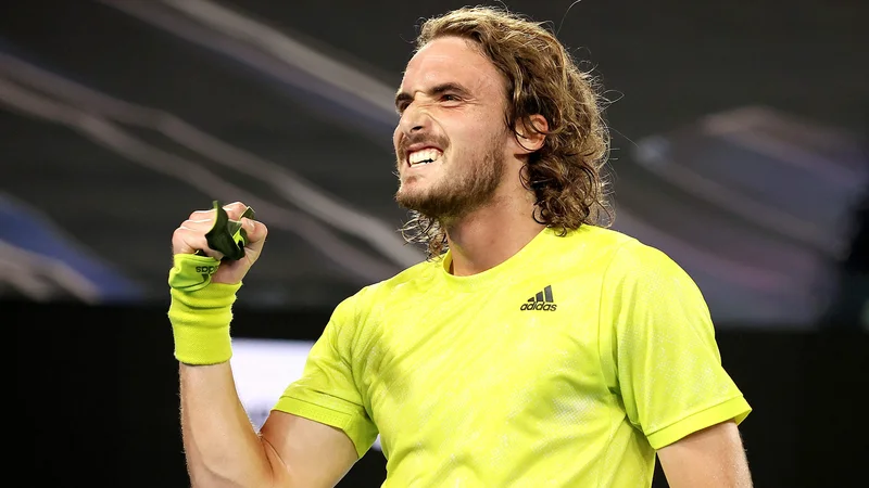 Grk Stefanos Tsitsipas je na OP Avstralije po velikem zasuku izločil Rafaela Nadala. FOTO: David Gray/AFP
