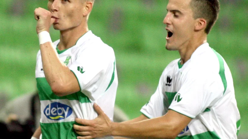 Fotografija: Dare Vršič (levo) je po naslovu prvaka s Koprom odšel k Olimpiji in v njenem dresu v sezoni 2012/13 postal tudi prvi strelec prvenstva. Foto: Roman Šipić