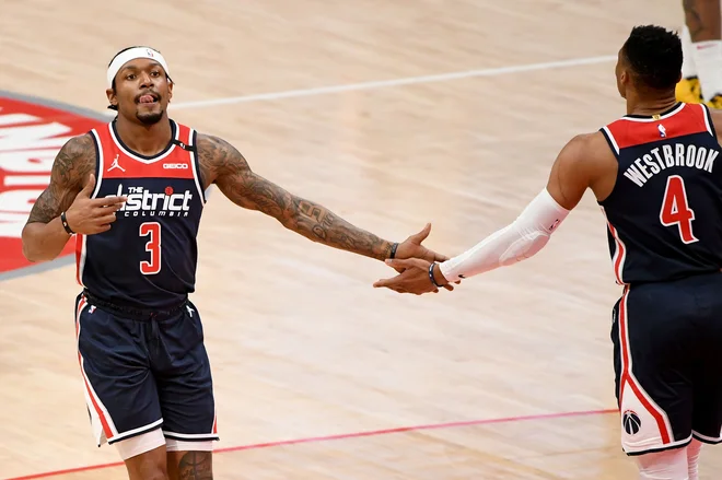 Bradley Beal je desetinko sekunde pred koncem tekme s prostima metoma zapečatil usodo Denverja. FOTO: Will Newton/AFP
