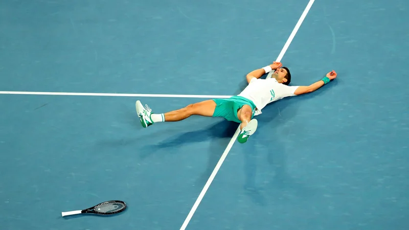 Fotografija: Novak Đoković je devetič osvojil OP Avstralije. FOTO:
Kelly Defina/Reuters