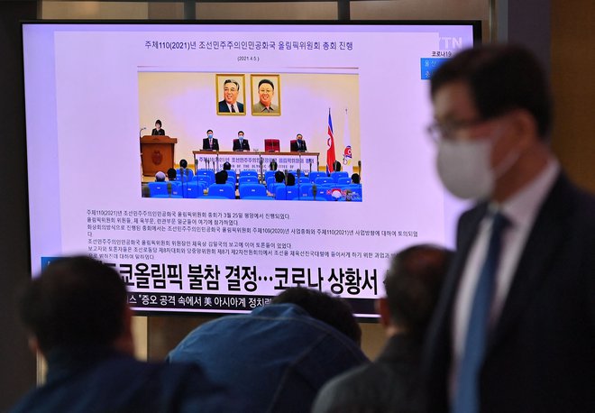 Severnokorejske oblasti so tako sporočile državljanom, da se njihovi športniki zaradi pandemije ne bodo udeležili olimpijskih iger v Tokiu. FOTO: Jung Yeon Je/AFP