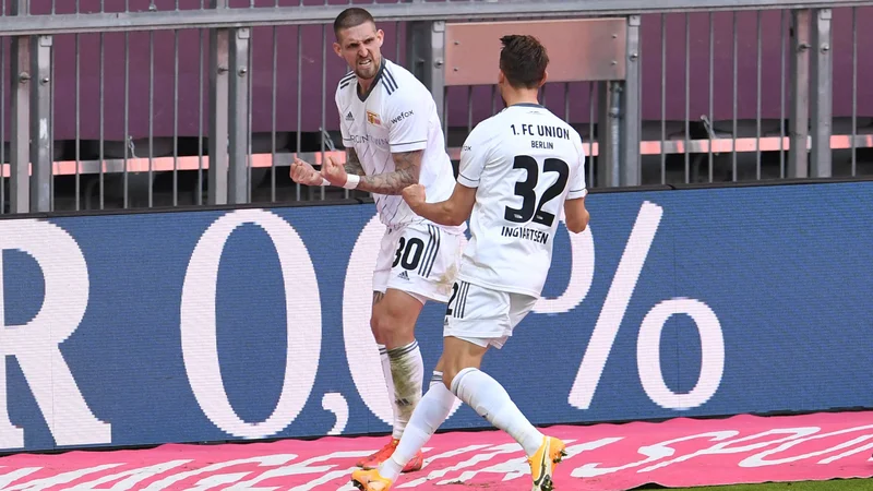 Fotografija: Union Berlin je v Münchnu pripravil presenečenje, izenačujoči gol za točko proti prvaku Bayernu je priigral Danec Marcus Ingvartsen. FOTO: Andreas Gebert/AFP