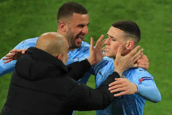 Pep Guardiola ni skrival čustev, ko je Phil Foden v Dortmundu zabil še drugi gol in potrdil napredovanje Manchester Cityja v polfinale lige prvakov. FOTO: Wolfgang Rattay/AFP