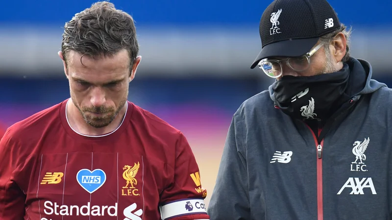 Fotografija: Nočeta je in je tudi ne marata: Liverpoolova kapetan in trener Jordan Henderson in Jürgen Klopp sta proti superligi. FOTO: Peter Powell/AFP