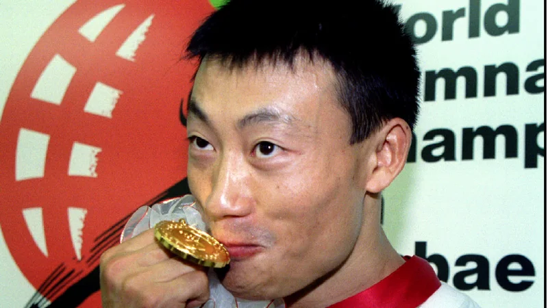 Fotografija: Donghua Li se spogleduje z nastopom na olimpijskih igrah leta 2024 v Parizu. Takrat bo star 56 let. FOTO: Reuters
