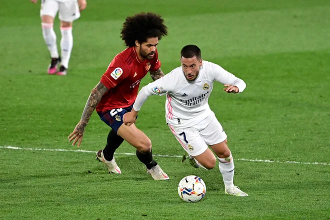 Eden Hazard stopnjuje formo in je veliki adut Zinedina Zidana za jutrišnji dvoboj proti Chelseaju. FOTO: Javier Soriano/AFP