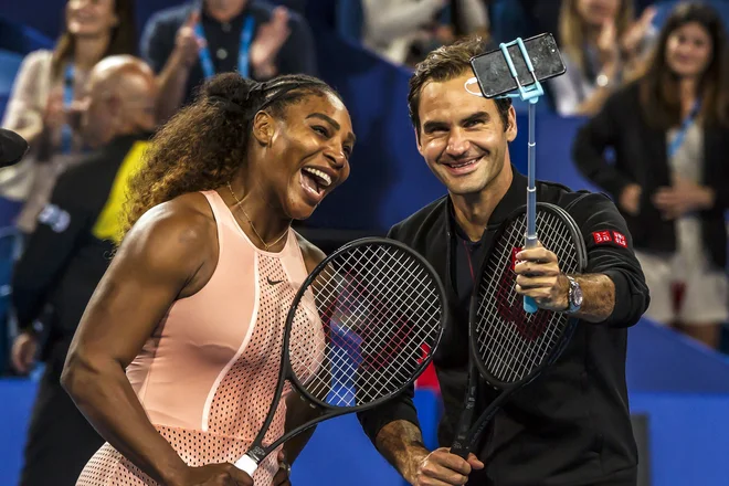 Serena Williams in Roger Federer sta sodelovala v dvojicah. FOTO: Tony Ashby/AFP