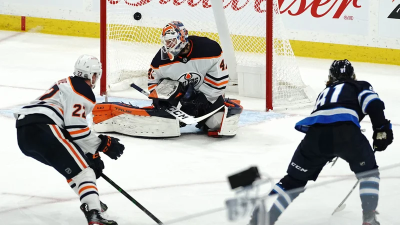 Fotografija: Kyle Connor je dosegel odločilni gol. FOTO: David Lipnowski/AFP