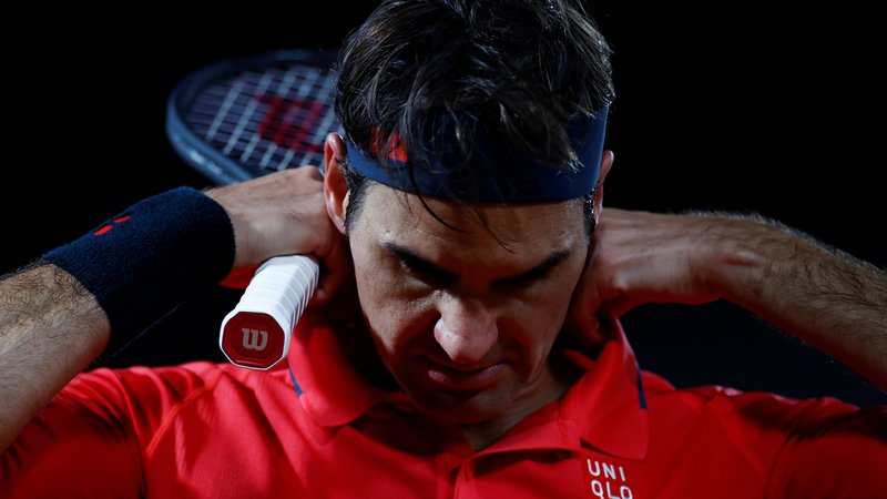 Fotografija: Roger Federer je poslušal telo in se odpovedal nastopu. FOTO: Christian Hartmann/Reuters