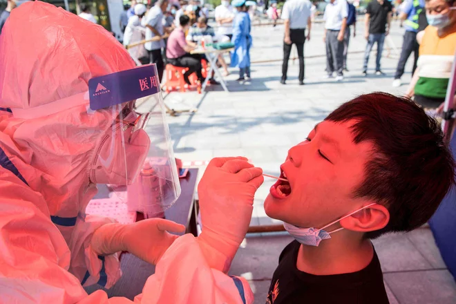 Med 21 novookuženimi v Tokiu ni športnikov. FOTO: Str/Afp