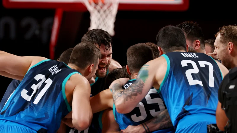 Fotografija: Tudi v Tokiu odmeva: Slovenija gre naprej! FOTO: Brian Snyder/Reuters