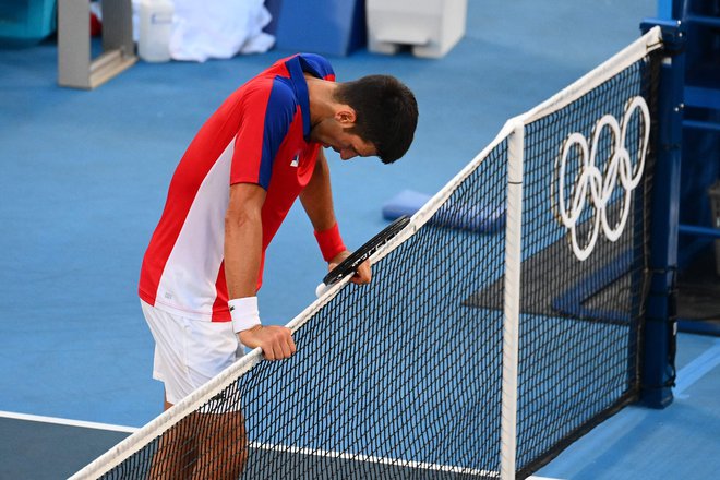 Novak Đoković je bil razočaran, ker je ostal brez kolajne. FOTO: Vincenzo Pinto/AFP