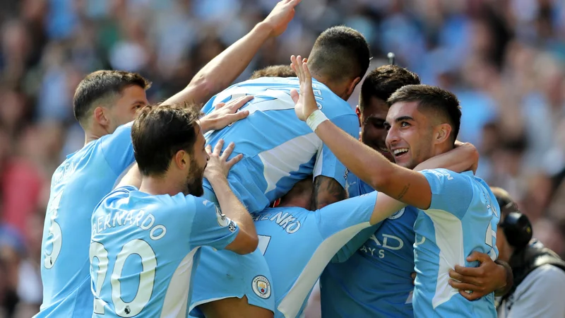 Fotografija: Igralci Manchester Cityja so slavili, Arsenal pa je pokazal še eno sramotno predstavo. FOTO: Russell Cheyne/Reuters