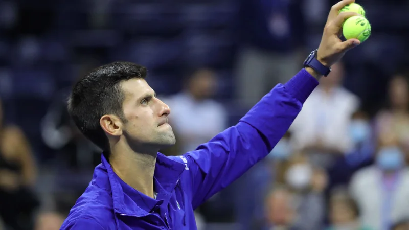 Fotografija: Novak Đoković lahko v nedeljo osvoji rekordni 21. turnir za grand slam. FOTO: Kena Betancur/AFP