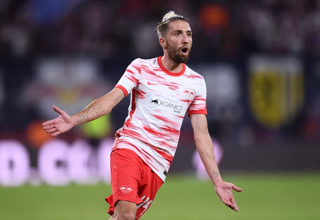 Kevin Kampl med tekmo z Bayernom. FOTO: Annegret Hilse/Reuters