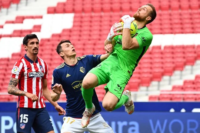 Jan Oblak je eden najboljših vratarjev v Evropi. FOTO: Gabriel Bouys/AFP