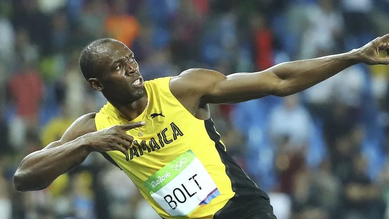 Fotografija: Usain Bolt zna poskrbeti za pozornost. FOTO: Lucy Nicholson/ Reuters