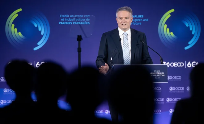Kot pravi generalni sekretar OECD Cormann bo mednarodni davčni sistem zdaj ustrezal svojemu namenu v digitalnem in globaliziranem svetovnem gospodarstvu. FOTO: Ian Langsdon/Afp