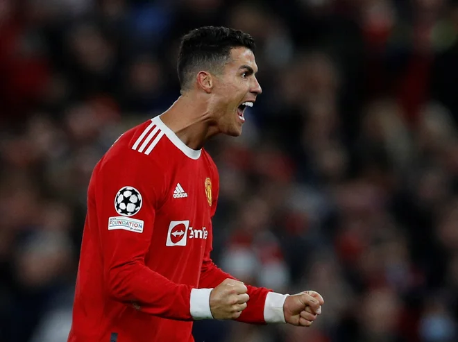 Cristiano Ronaldo tudi pri 36 letih izžareva motiv in neverjetno željo po golih in zmagah. FOTO: Phil Noble/Reuters

