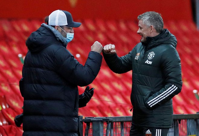 Danes se bosta spet sešla trenerja Liverpoola in Manchester Uniteda Jürgen Klopp in Ole Gunnar Solskjaer. FOTO: Phil Noble/Reuters

