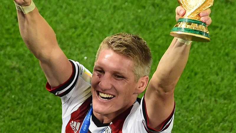 Fotografija: Bastian Schweinsteiger je leta 2014 z naslovom svetovnega prvaka v Braziliji kronal izjemno obdobje v dresu reprezentance in Bayerna, s katerim je leto prej osvojil zgodovinsko trojno krono. FOTO: Francois Xavier Marit/AFP
