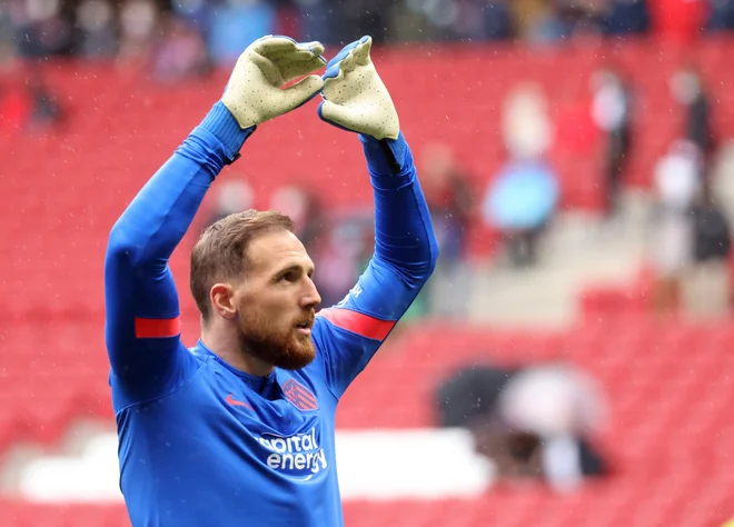 Jan Oblak (na fotografiji) nikakor ne najde recepta za daljši niz nepremaganosti v tekoči sezoni. FOTO. Juan Medina/Reuters
