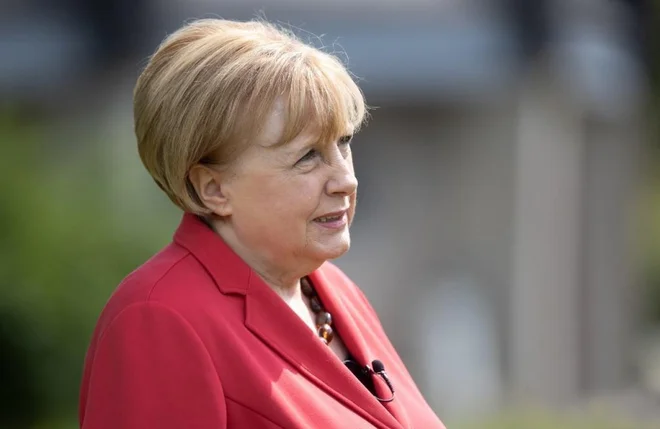 Ursula Wanecki si želi, da bi kanclerko Angelo Merkel nekoč tudi osebno srečala in z njo izmenjala nekaj besed. FOTO: Dieter Menne/AFP